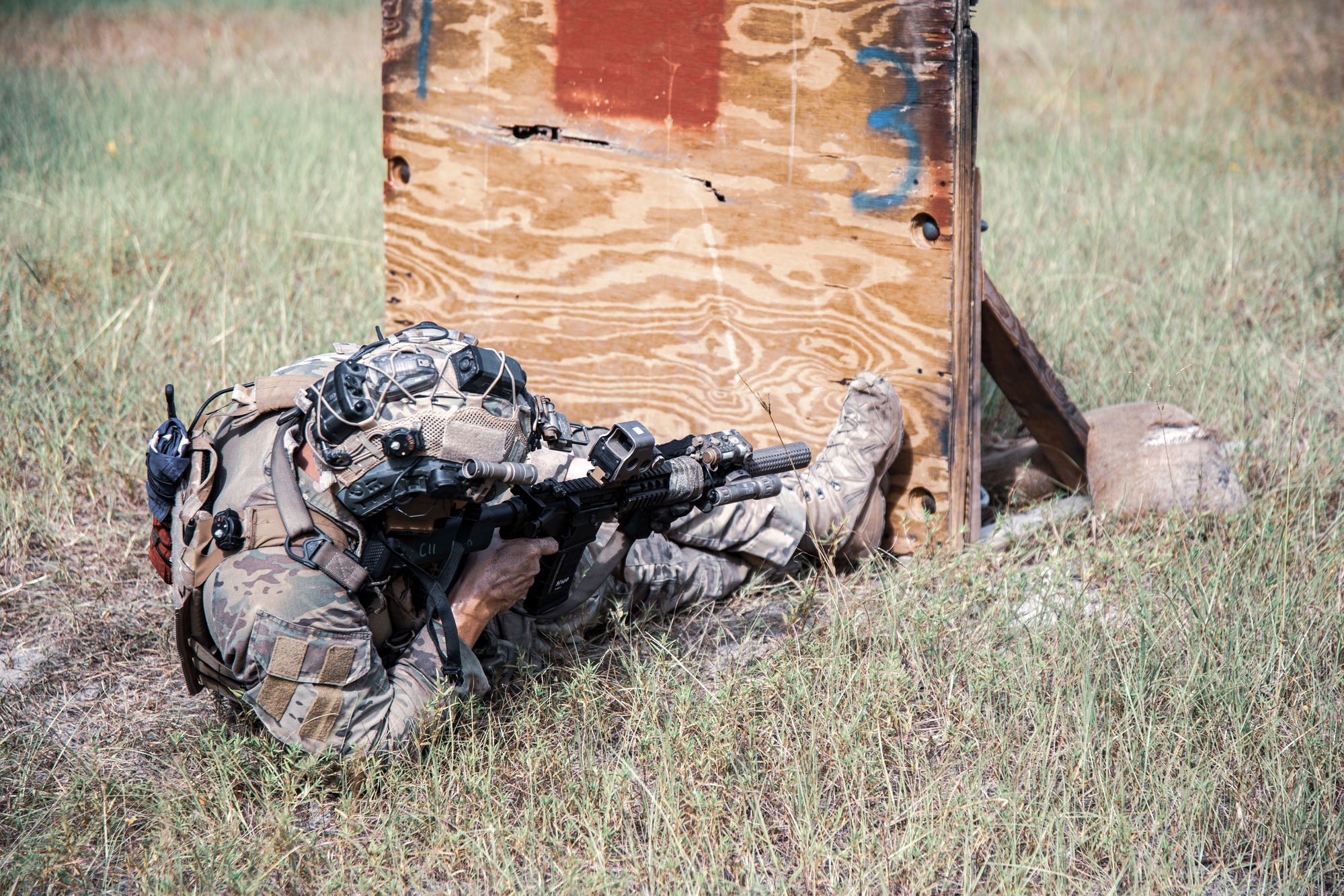 Shooter firing from an extremely low position around a barricade